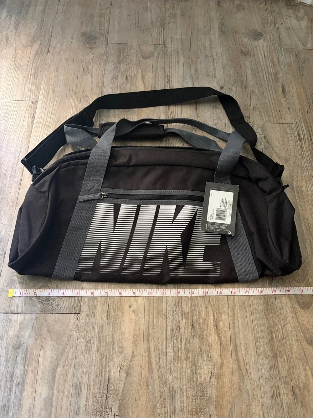 Nike Black Duffel Bag with Gray Straps and White Logo